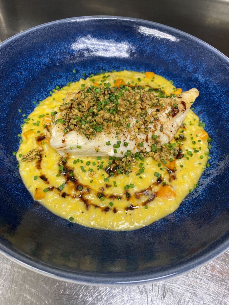 The fluke with butternut squash ristotto was the first meal Matt McCarthy made for his father, Gregg, after assuming the role of executive chef at Murphy's in Virginia-Highland. / Courtesy of Matt McCarthy
