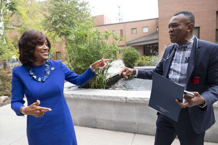 Dr. Montgomery Rice greets faculty member Dr. Rigobert Lapu after running into him on the Morehouse School of Medicine campus on the first day of class. (Ben Gray / Ben@BenGray.com)