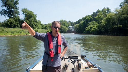 Executive Director of the Chattahoochee Riverkeeper Jason Ulseth surveys the river during a boat patrol ride on June 14, 2024.
