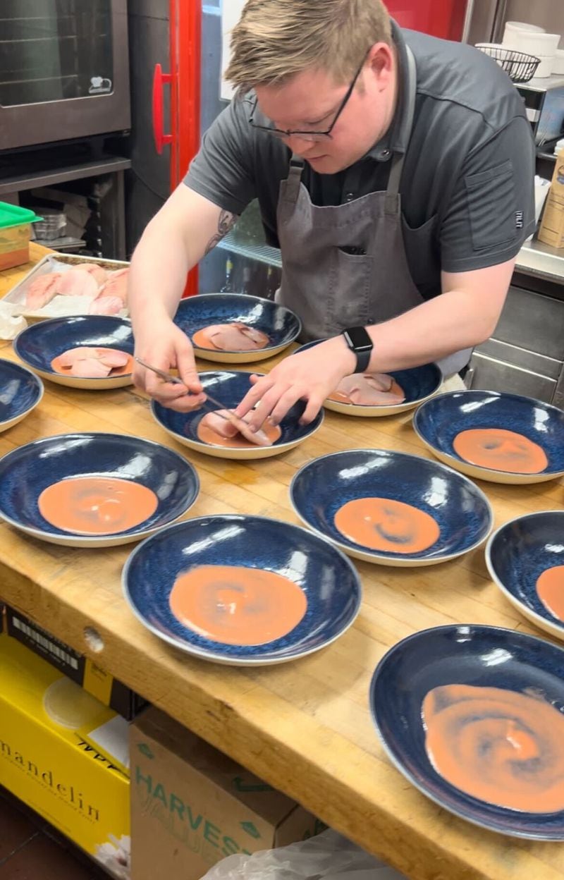Matt McCarthy, the executive chef at Murphy's in Virginia-Highland, prepares a hamachi dish in the restaurant's kitchen. / Courtesy of Matt McCarthy