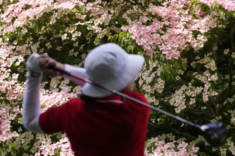 Amy Yang, of South Korea, watches her shot after hitting from the from the 11th tee during the final round of the Women's PGA Championship golf tournament at Sahalee Country Club, Sunday, June 23, 2024, in Sammamish, Wash. (AP Photo/Lindsey Wasson)