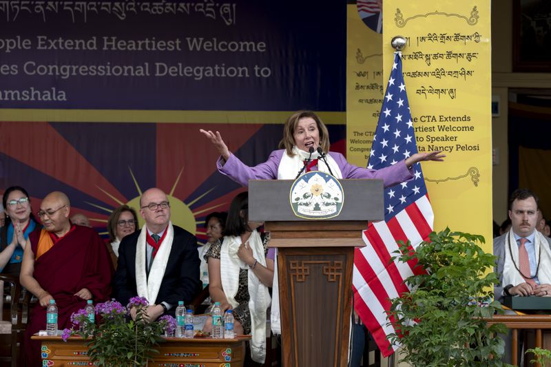 Democratic former House Speaker Nancy Pelosi gestures as she speaks at a public event during which a US delegation led by Republican Rep. Michael McCaul was felicitated by the President of the Central Tibetan Administration and other officials at the Tsuglakhang temple in Dharamshala, India, Wednesday, June 19, 2024. (AP Photo/Ashwini Bhatia)