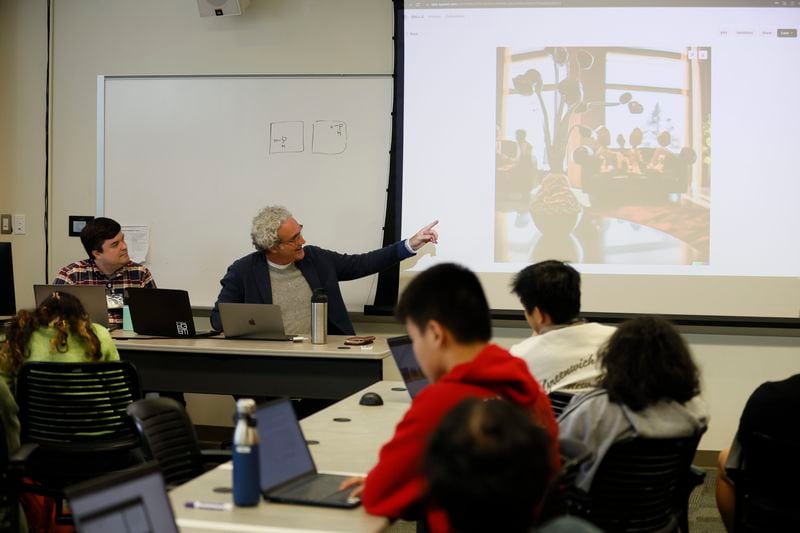 Georgia Tech professor Mark Leibert (right) leads a class with students at the School of Literature, Media, and Communication during an Art and Artificial Intelligence class on Tuesday, January 31, 2022 (Miguel Martinez / miguel.martinezjimenez@ajc.com)