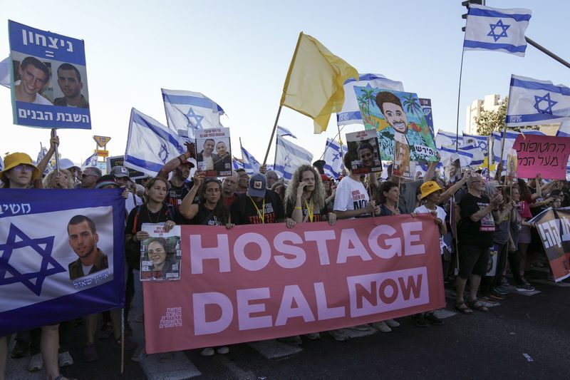 Family members and supporters of the hostages held captive by Hamas in Gaza complete the final leg of a four-day march from Tel Aviv to Jerusalem to demand the immediate release of all hostages in Jerusalem on Saturday, July 13, 2024. (AP Photo/Mahmoud Illean)