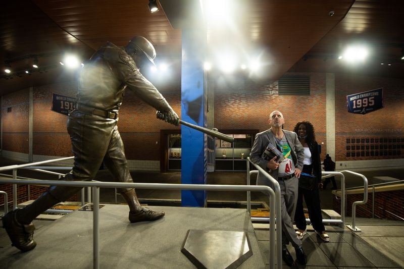 Fans visit the Hank Aaron exhibit at Truist Park in Atlanta on Wednesday, July 31, 2024, during the United State Postal Service dedication ceremony for the first day of the Aaron commemorative stamp being issued. (Ziyu Julian Zhu / AJC)