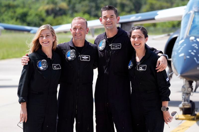 Astronauts, from left, mission specialist Anna Menon, pilot Scott Poteet, commander Jared Isaacman and mission specialist Sarah Gillis arrive at the Kennedy Space Center for an upcoming private human spaceflight mission in Cape Canaveral, Fla., Monday, Aug. 19, 2024. (AP Photo/John Raoux)