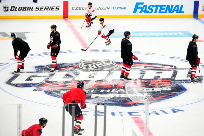 New Jersey Devils' attend a practice session, a day before their NHL hockey game against Buffalo Sabres, in Prague, Czech Republic, Thursday, Oct. 3, 2024. (AP Photo/Petr David Josek)