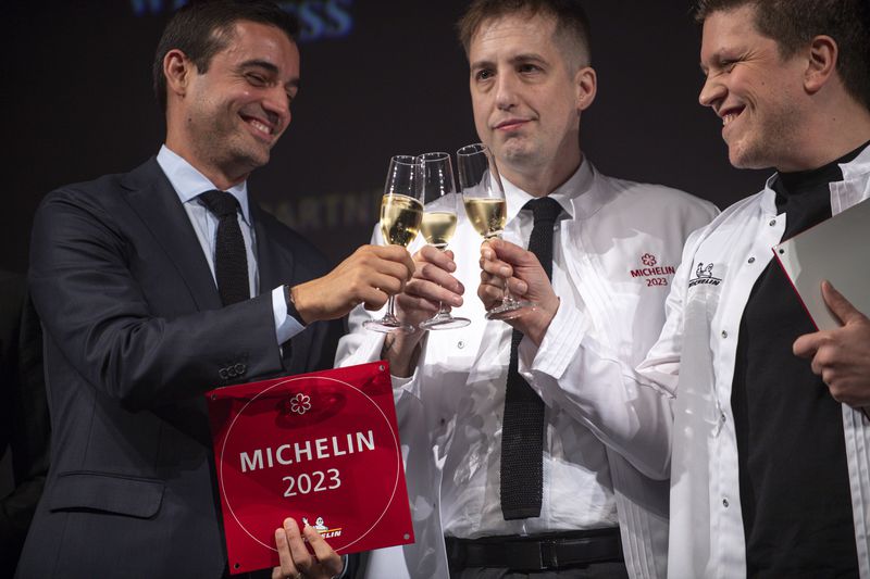 Fred Castellucci (from left) and J. Trent Harris of Mujo and Freddy Money of Atlas celebrate their restaurants' one-star Michelin ratings. Daniel Varnado for The Atlanta Journal-Constitution