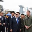 FILE - South Korean President Yoon Suk Yeol, center, boards the USS Theodore Roosevelt aircraft carrier at the South Korean naval base in Busan, South Korea, June 25, 2024. (South Korean Presidential Office/Yonhap via AP, File)