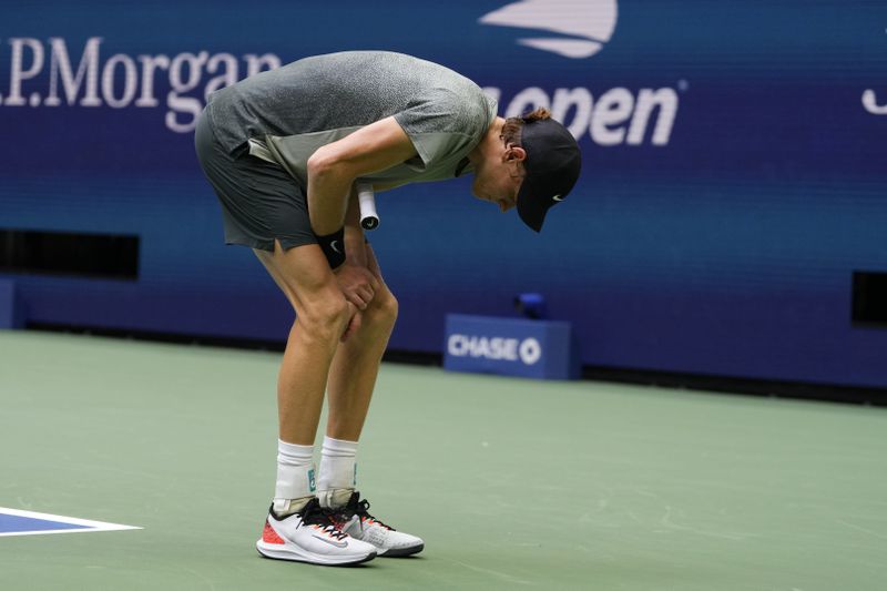 Jannik Sinner, of Italy, holds his wrist after returning a shot to Jack Draper, of Great Britain, during the men's singles semifinals of the U.S. Open tennis championships, Friday, Sept. 6, 2024, in New York. (AP Photo/Kirsty Wigglesworth)