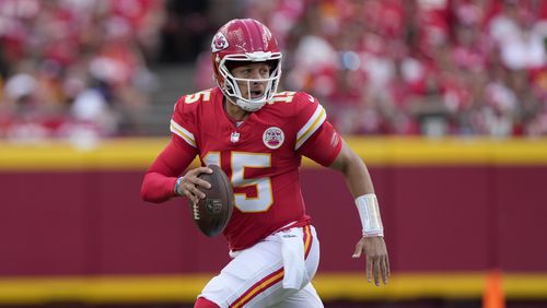 Kansas City Chiefs quarterback Patrick Mahomes runs with the ball during the first half of an NFL football game against the Cincinnati Bengals Sunday, Sept. 15, 2024, in Kansas City, Mo. (AP Photo/Charlie Riedel)