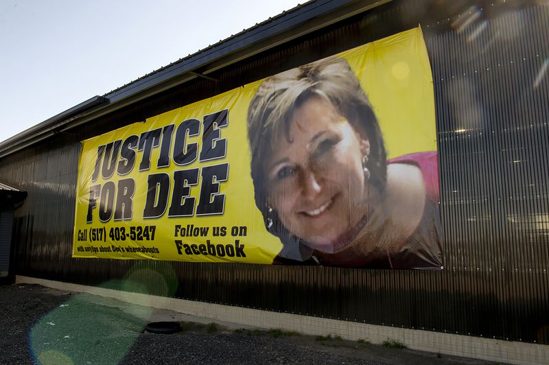 A banner shows a photo of missing woman Dee Warner in Tipton, Mich. on May 9 2022. (Jacob Hamilton/Jackson Citizen Patriot via AP)