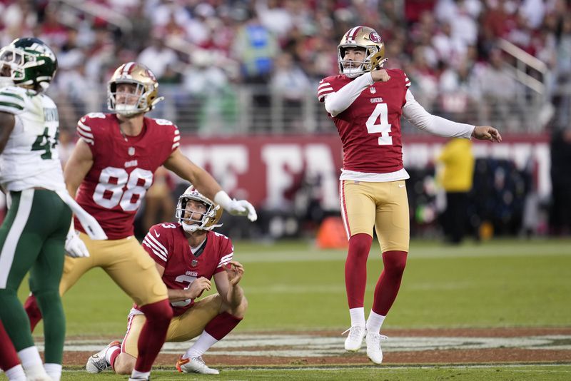 San Francisco 49ers place-kicker Jake Moody (4) watches his field goal with Jake Tonges (88) and Mitch Wishnowsky (3) during the second half of an NFL football game against the New York Jets in Santa Clara, Calif., Monday, Sept. 9, 2024. (AP Photo/Godofredo A. Vásquez)