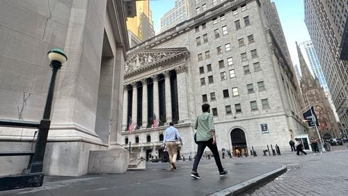 FILE - People approach the New York Stock Exchange on Aug. 27, 2024, in New York. (AP Photo/Peter Morgan, File)