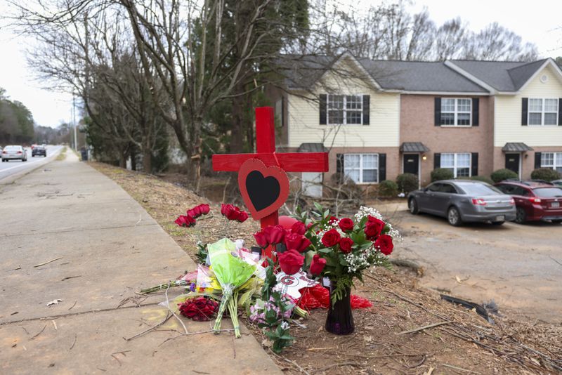 A memorial at the site of the crash that killed Georgia football staffer Chandler LeCroy and player Devin Willock.