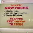 A hiring sign is displayed at a Dunkin' in Glenview, Ill., Tuesday, October. 1, 2024. (AP Photo/Nam Y. Huh)