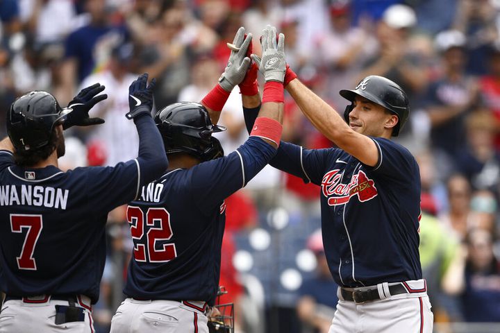 Atlanta Braves' Austin Riley (27) celebrates with Matt Olson after