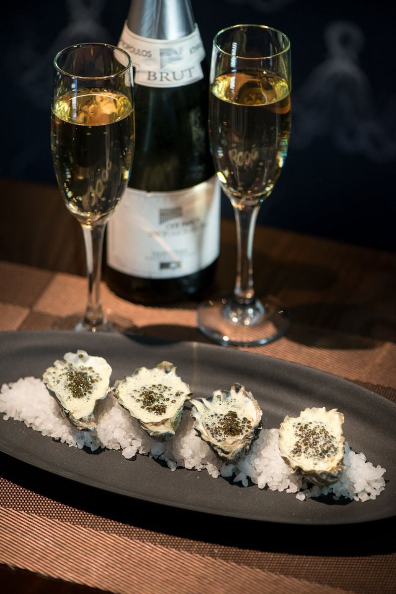 Roasted oysters with Champagne “avgolemono” and Russian Ossetra caviar at Kyma. Add to the atmosphere with glasses of the Greek sparkling white, Ode Panos. CONTRIBUTED BY MIA YAKEL