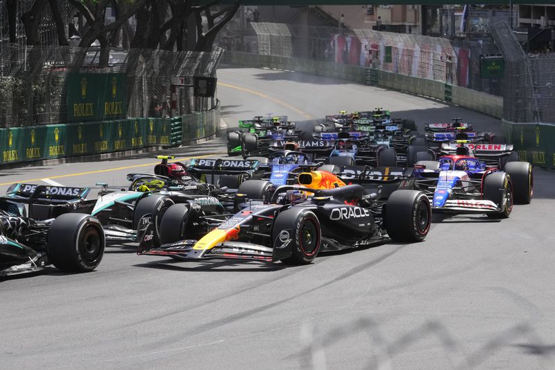 Red Bull driver Max Verstappen of the Netherlands, centre, steers his car during the Formula One Monaco Grand Prix race at the Monaco racetrack, in Monaco, Sunday, May 26, 2024. (AP Photo/Luca Bruno)
