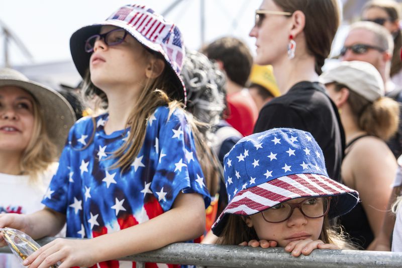People wait for the Nathan's Famous Fourth of July hot dog eating contest to start, Thursday, July 4, 2024 at Coney Island in the Brooklyn borough of New York. (AP Photo/Julia Nikhinson)