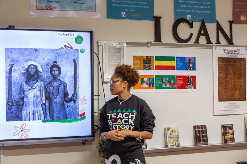 Kelsey Allen presents a portion of her class project to her Advanced Placement African American Studies class at Maynard Jackson High School on Feb 17, 2023.