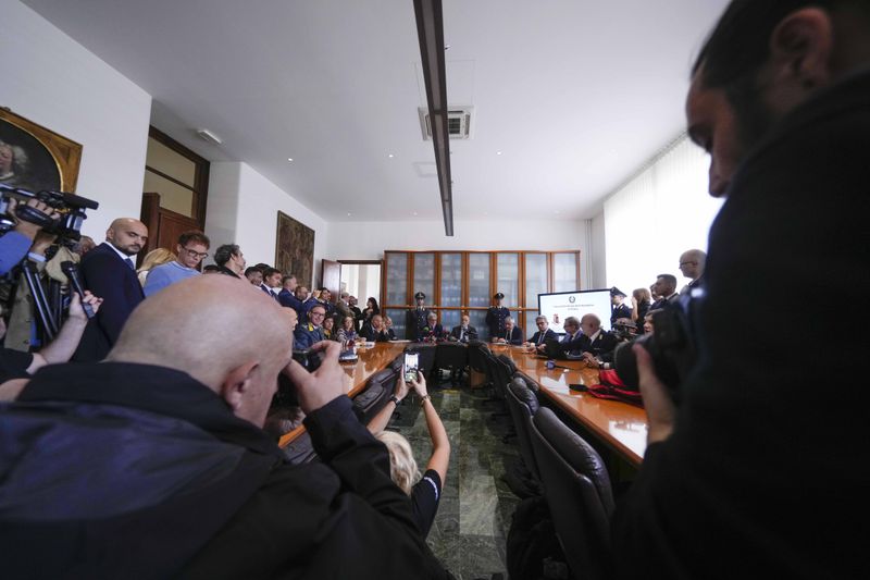 National Anti-Mafia Prosecutor Giovanni Milillo, center left, and Milan's Prosecutor Marcello Viola, center right, attend a news conference at the Milan's court, in Milan, Italy, Monday, Sept. 30, 2024. (AP Photo/Luca Bruno)