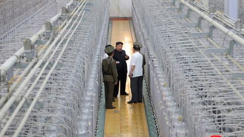 FILE - This undated photo provided on Sept. 13, 2024, by the North Korean government shows its leader Kim Jong Un, center, on an inspecting visit at what they say is an institute of nuclear weapons and a facility for nuclear materials at an undisclosed location in North Korea. Independent journalists were not given access to cover the event depicted in this image distributed by the North Korean government. The content of this image is as provided and cannot be independently verified. Korean language watermark on image as provided by source reads: "KCNA" which is the abbreviation for Korean Central News Agency. (Korean Central News Agency/Korea News Service via AP, File)