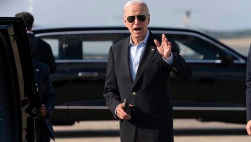 President Joe Biden talks to reporters upon his arrival to Joint Base Andrews, Md., en route to the White House, Sunday, Aug. 18, 2024. (AP Photo/Jose Luis Magana)