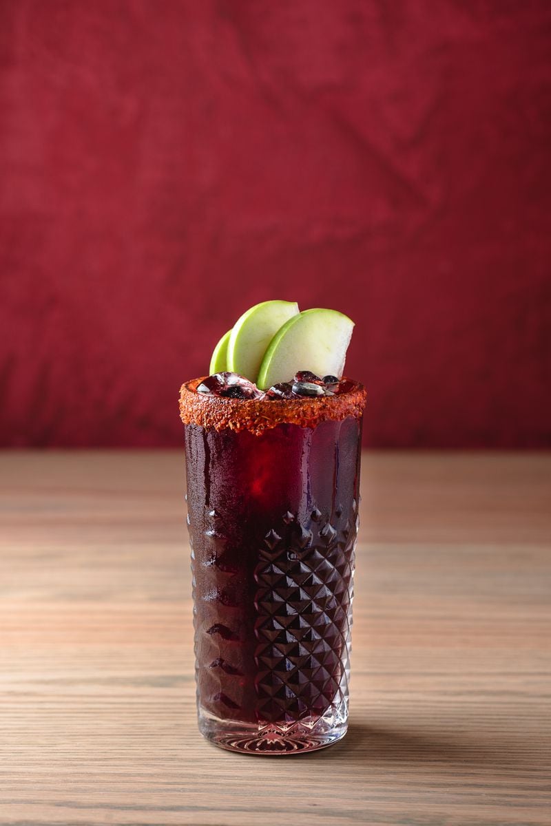 Chicha morada, a traditional Peruvian beverage from purple corn, from the Chicheria menu. This is a non-alcoholic drink.