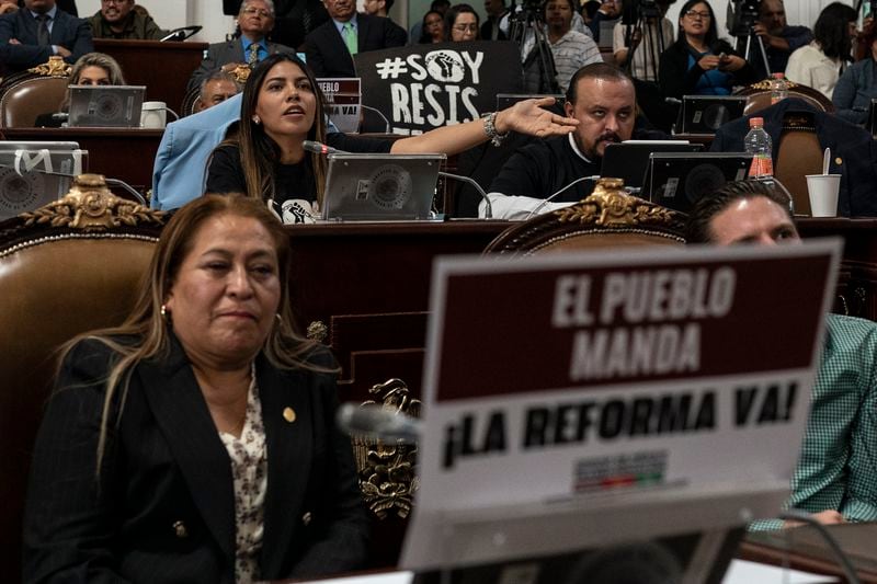 Representatives discuss the judicial reform bill at the City Council in Mexico City, Thursday, Sept. 12, 2024. (AP Photo/Felix Marquez)