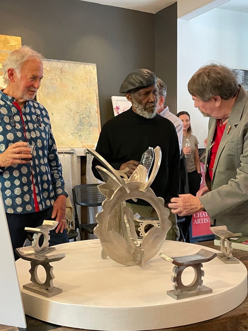 Patterson shares a maquette of his sculpture with Serenbe neighbors Herb Brown (left) and Black Art Project jurist Phill Tabb.