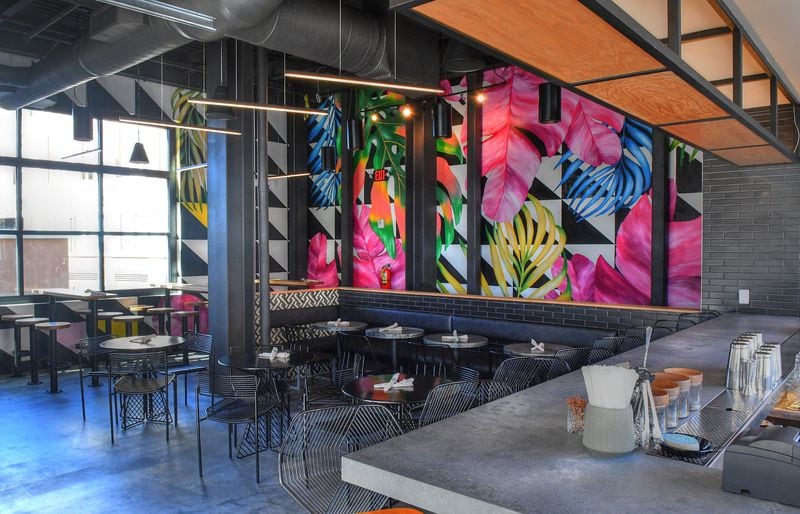 Upper level bar and dining area with wall mural by female artists Lela Brunet and Janice Rago at Azotea Cantina at Atlantic Station. (Chris Hunt for The Atlanta Journal-Constitution)
