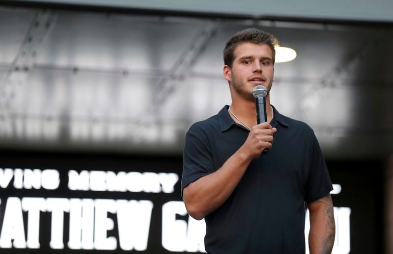 Columbus Blue Jackets player Cole Sillinger speaks during a candlelight vigil to honor Blue Jackets hockey player Johnny Gaudreau, Thursday, Sept. 4, 2024, outside of Nationwide Arena in Columbus, Ohio. Gaudreau and his brother Matthew were killed by a motor vehicle last week while riding bicycles. (AP Photo/Joe Maiorana)