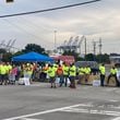 Union dockworkers picket at the main gate at the Georgia Ports Authority's Garden City Terminal in Savannah on Tuesday, Oct. 1, 2024 as part of the International Longshoremen's Association strike. (Adam Van Brimmer/AJC)