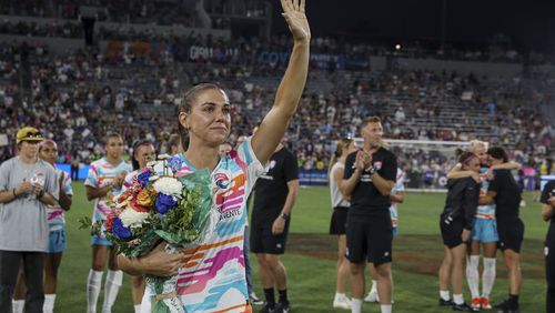 San Diego Wave's Alex Morgan waves after an NWSL soccer game against the North Carolina Courage on Sunday, Sept. 8 2024, in San Diego. (Sandy Huffaker/The San Diego Union-Tribune via AP)