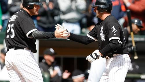 The Chicago White Sox's Jim Thome (25) greets teammate Paul Konerko after his grand slam against the Detroit Tigers at U.S. Cellular Field in Chicago on April 13, 2008. (Nuccio DiNuzzo/Chicago Tribune/TNS)