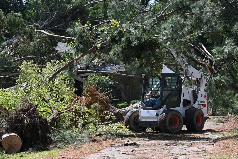 Crew clean up fallen trees after Helene's devastating march through Georgia. (Hyosub Shin / AJC)