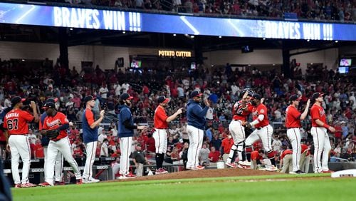 Braves players celebrate 9-1 victory over St. Louis Cardinals Friday, June 18, 2021, at Truist Park in Atlanta. (Hyosub Shin / Hyosub.Shin@ajc.com)