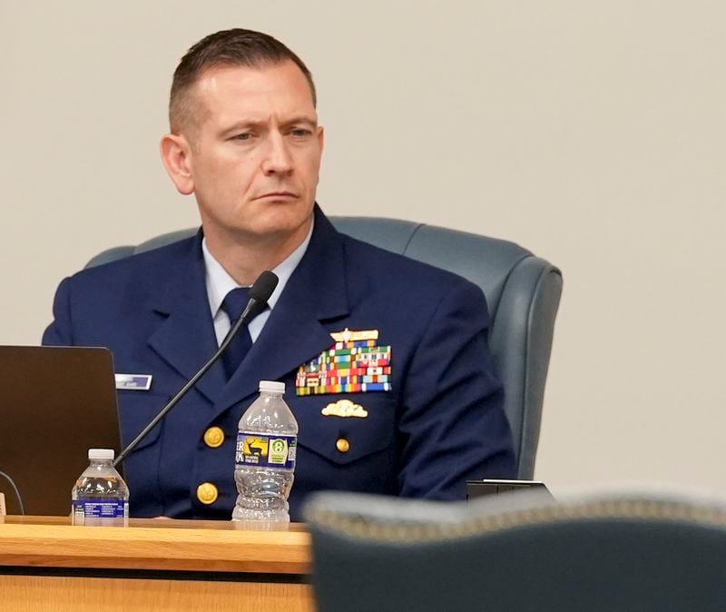 Lars Okmark, LCDR, legal counsel, listens during the Titan marine board formal hearing inside the Charleston County Council Chambers, Thursday, Sept. 19, 2024, in North Charleston, S.C. (Corey Connor via AP, Pool)