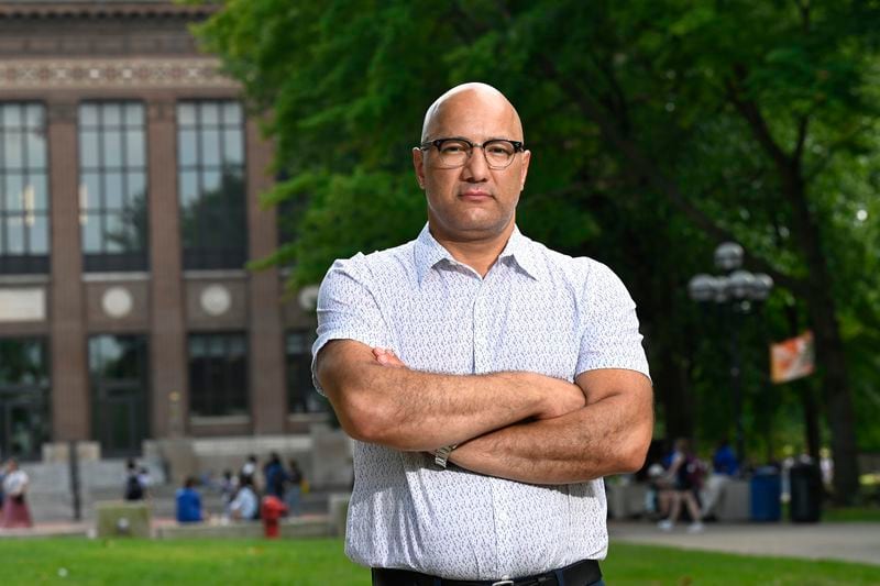 Jerusalem Garden restaurant owner and operator Ali Ramlawi stands on the campus of the University of Michigan, Thursday, Aug. 29, 2024, in Ann Arbor, Mich. (AP Photo/Jose Juarez)