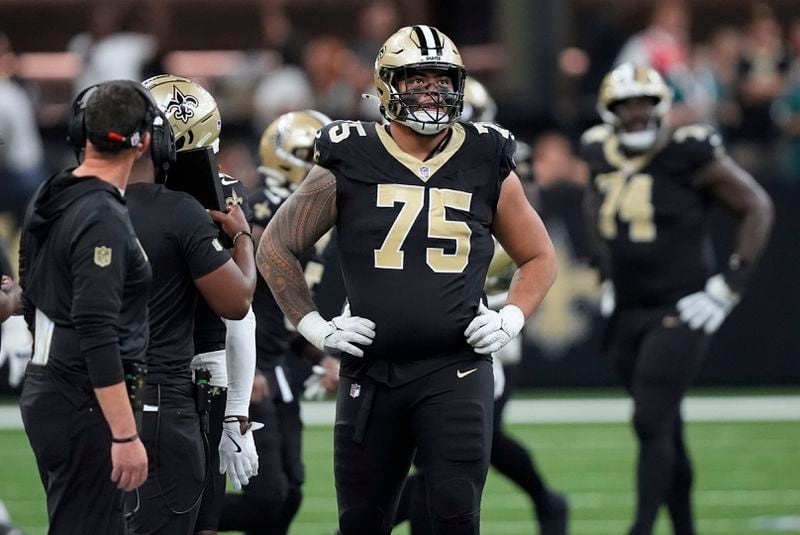 New Orleans Saints offensive tackle Taliese Fuaga (75) looks up at the scoreboard after the Philadelphia Eagles stopped the Saints' final drive with an interception in the fourth quarter of an NFL football game in New Orleans, Sunday, Sept. 22, 2024. (AP Photo/Gerald Herbert)