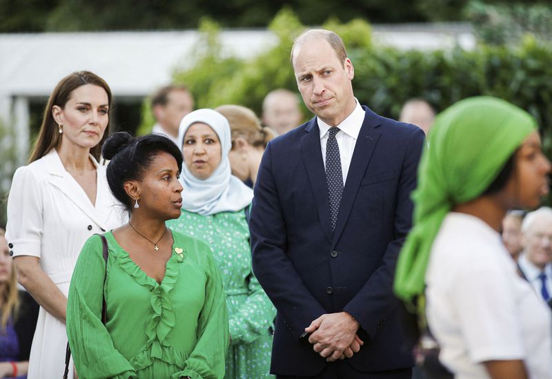 FILE - Britain's Prince William and Kate, Duchess of Cambridge attend a multi-faith and wreath laying ceremony at base of Grenfell Tower in London, Tuesday, June 14, 2022. (Peter Nicholls/Pool Photo via AP, File)