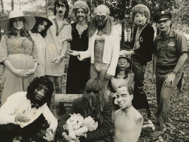 The Hahavishnu Orchestra poses in a metro Atlanta cemetery for a publicity photo. Darryl Rhoades is at center, with his waist-length hair combed over his face. Photo: Tom Albright