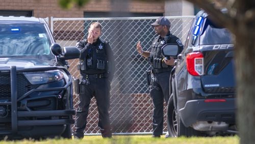 Barrow County law enforcement were posted outside the now fenced-in Apalachee High School on Thursday, Sept. 5, 2024. A 14-year-old is accused of shooting and killing two fellow students and two teachers and injuring nine others at the Barrow County school on Wednesday. (John Spink/AJC)