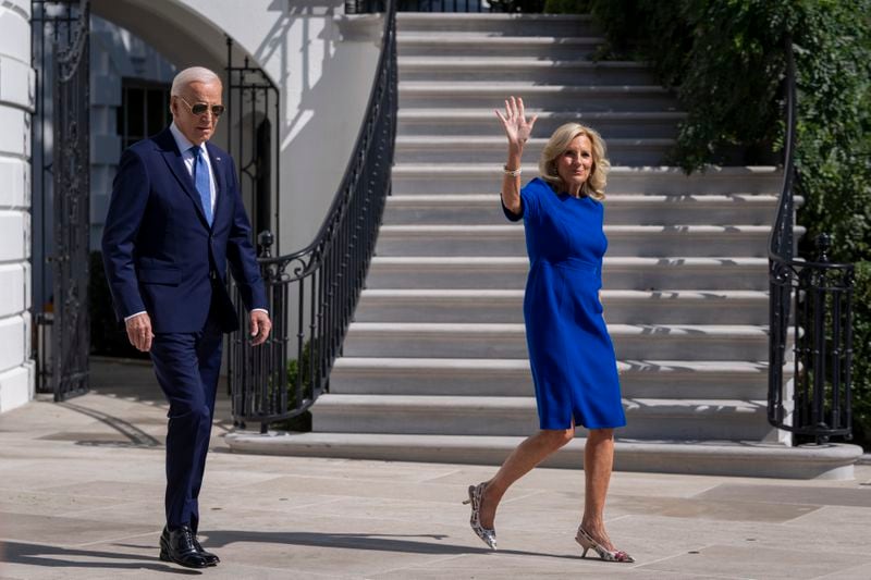 President Joe Biden, left, and first lady Jill Biden walk to Marine One on the South Lawn of the White House in Washington, Saturday, Oct. 5, 2024. (AP Photo/Ben Curtis)