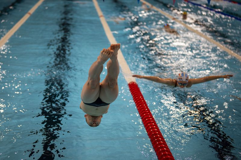 Guo Jincheng, of China, jumps into the pool during a warm up session ahead of a competition, during the 2024 Paralympics, Tuesday, Sept. 3, 2024, in Paris, France. (AP Photo/Emilio Morenatti)