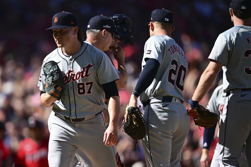 Detroit Tigers relief pitcher Tyler Holton (87) is taken out of the game in the first inning during Game 1 of baseball's AL Division Series against the Cleveland Guardians, Saturday, Oct. 5, 2024, in Cleveland. (AP Photo/David Dermer)