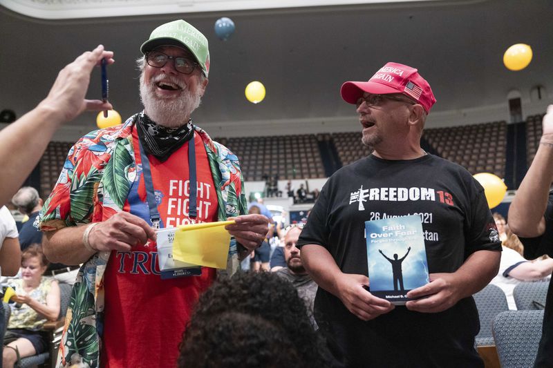 People cheer during the Moms for Liberty National Summit in Washington, Saturday, Aug. 31, 2024. (AP Photo/Jose Luis Magana)