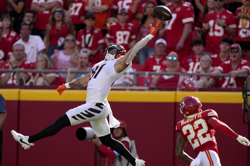 Cincinnati Bengals wide receiver Jermaine Burton (81) is unable to catch a pass in the end zone as Kansas City Chiefs cornerback Trent McDuffie (22) defends during the first half of an NFL football game Sunday, Sept. 15, 2024, in Kansas City, Mo. (AP Photo/Charlie Riedel)