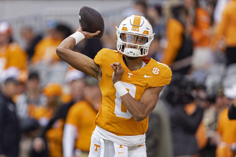 FILE - Tennessee quarterback Nico Iamaleava (8) throws to a receiver during warmups before an NCAA college football game against Vanderbilt Saturday, Nov. 25, 2023, in Knoxville, Tenn. (AP Photo/Wade Payne, File)